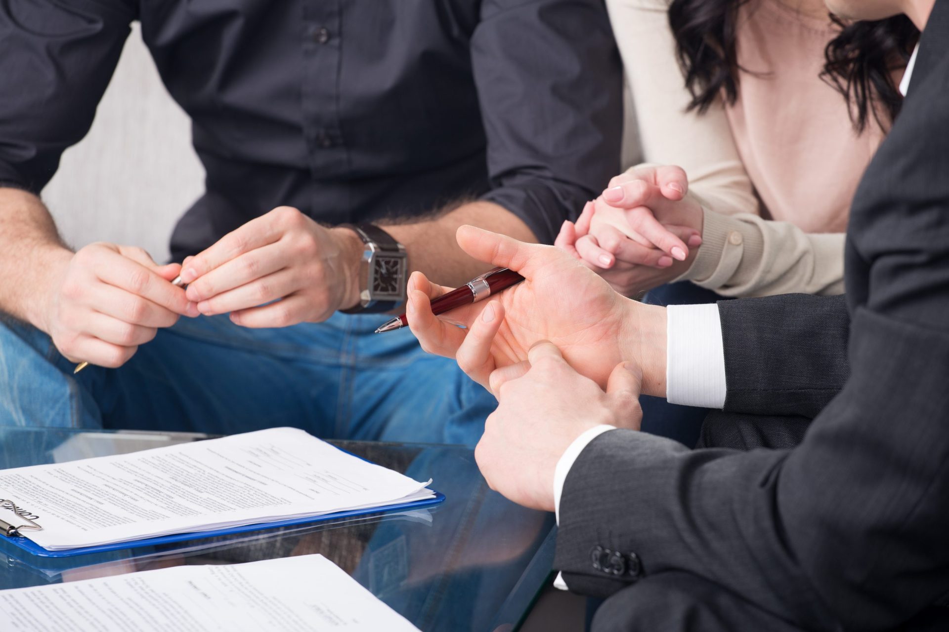 injury lawyer is discussing something with client's couple injury attorney is discussing something with client's couple